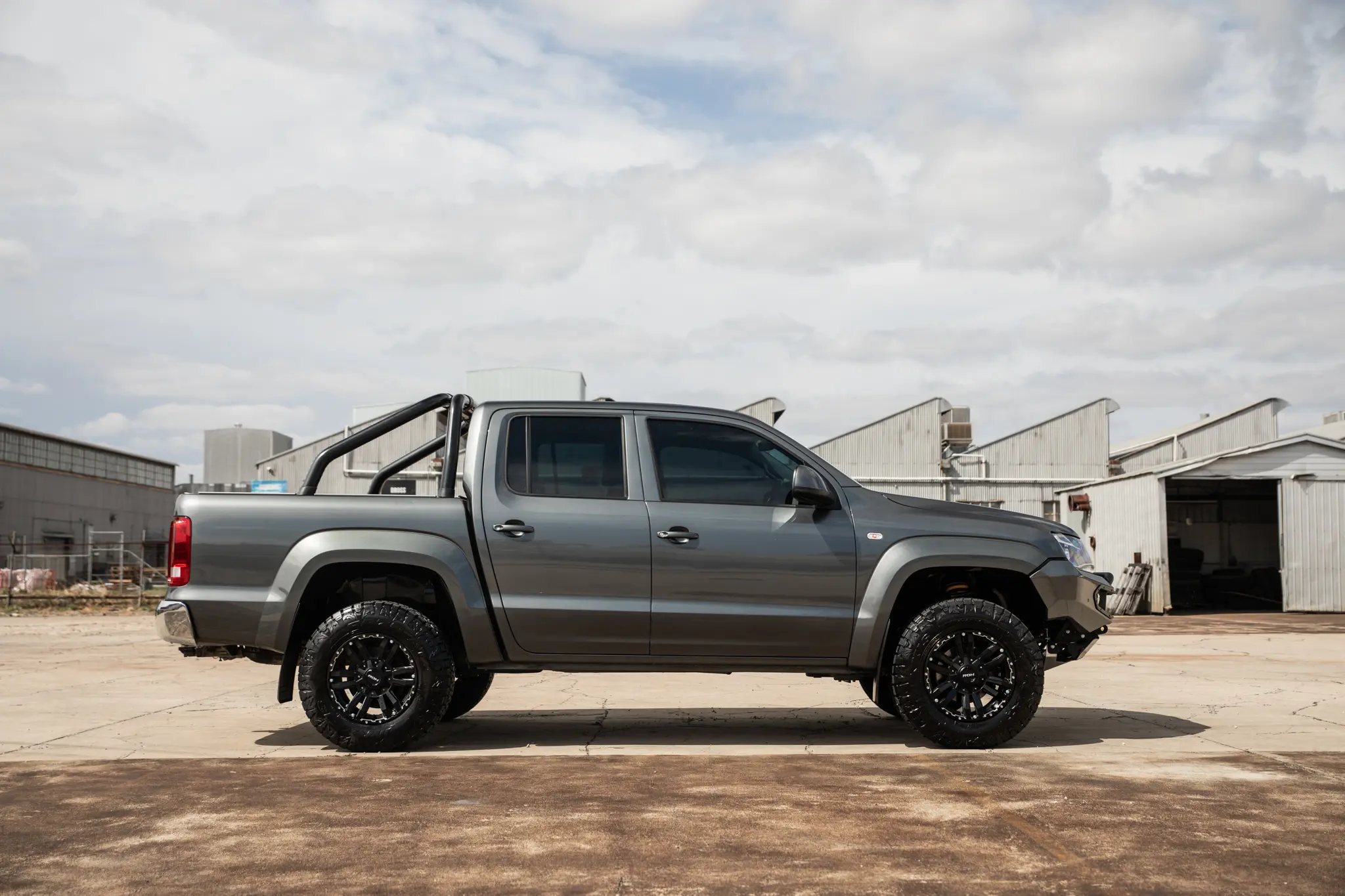 Volkswagen Amarok with 17x9 +30 ROH Vapour Matte Black Machined Accents Wheel in industrial area