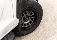 Mitsubishi Triton MV GSR with ROH Assault Graphite Centre Black Lip 4x4 Wheel in industrial area