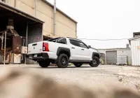 Mitsubishi Triton MV GSR with ROH Assault Graphite Centre Black Lip 4x4 Wheel in industrial area