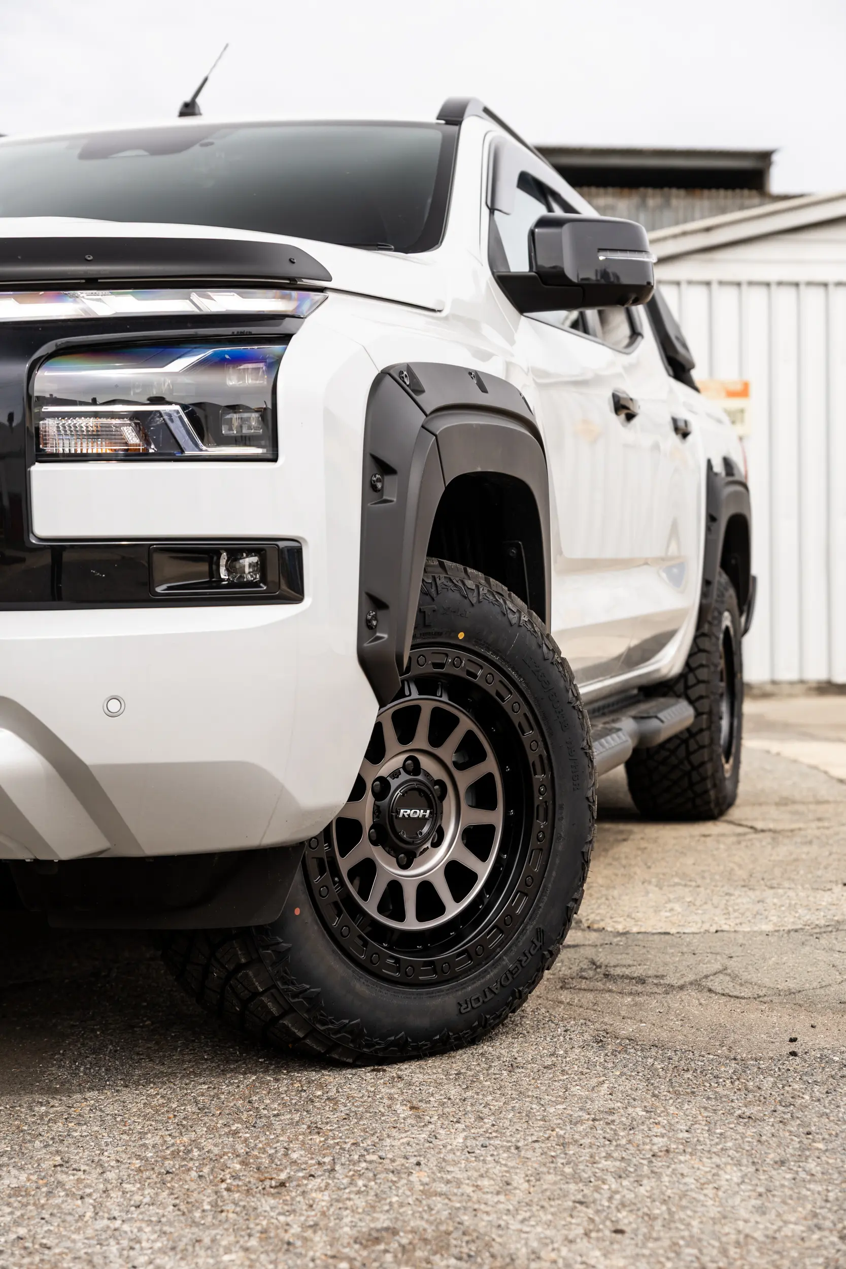 Mitsubishi Triton MV GSR with ROH Assault Graphite Centre Black Lip 4x4 Wheel in industrial area