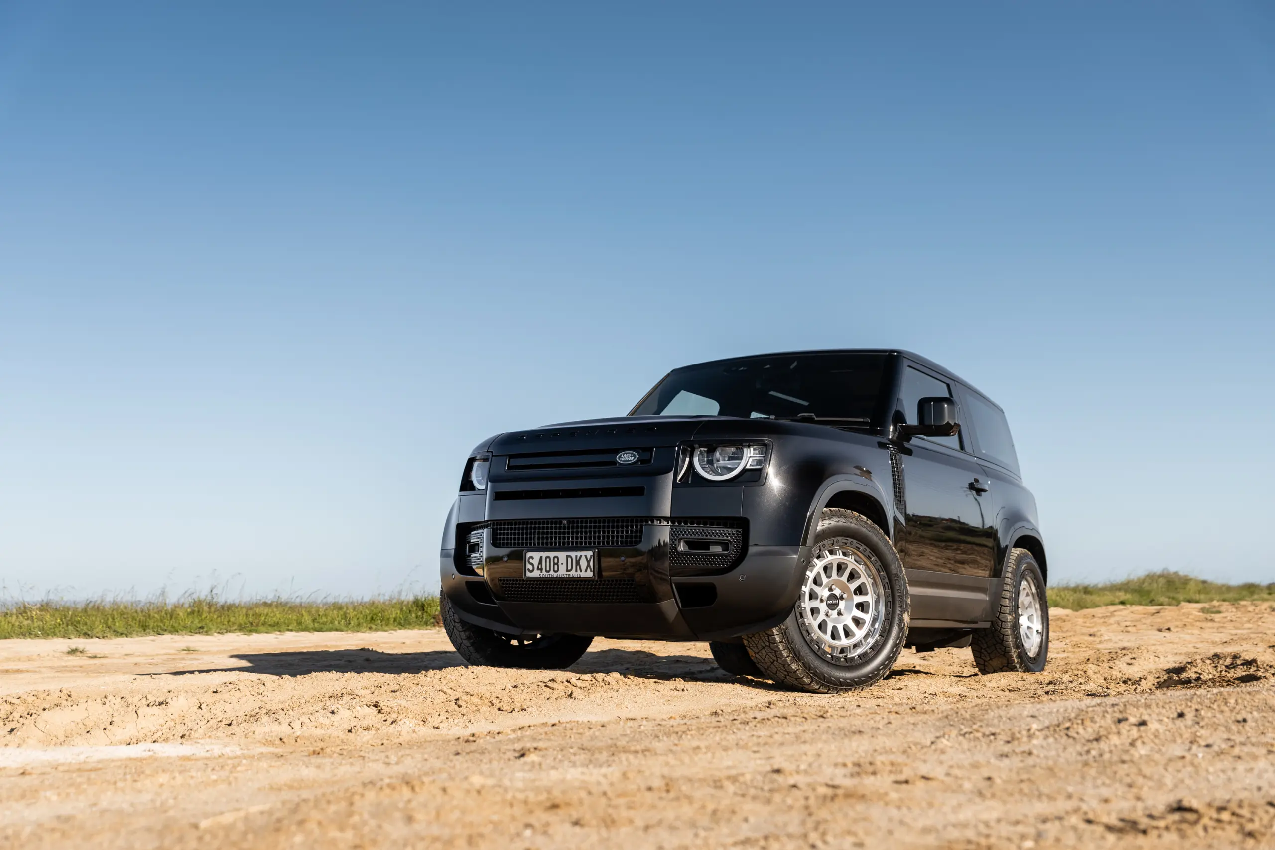 Black Land Rover Defender 90 with 20x9 +22 5x120 Machined Centre Black Lip ROH Assault Wheels