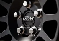 Black Land Rover Defender 90 with 20x9 +22 5x120 Matte Black ROH Assault Wheels at dockyard
