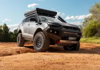 Grey Isuzu MU-X with ROH Atlas 4x4 Wheel in Graphite Centre Black Lip finish off road