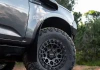 Grey Isuzu MU-X with ROH Atlas 4x4 Wheel in Graphite Centre Black Lip finish off road