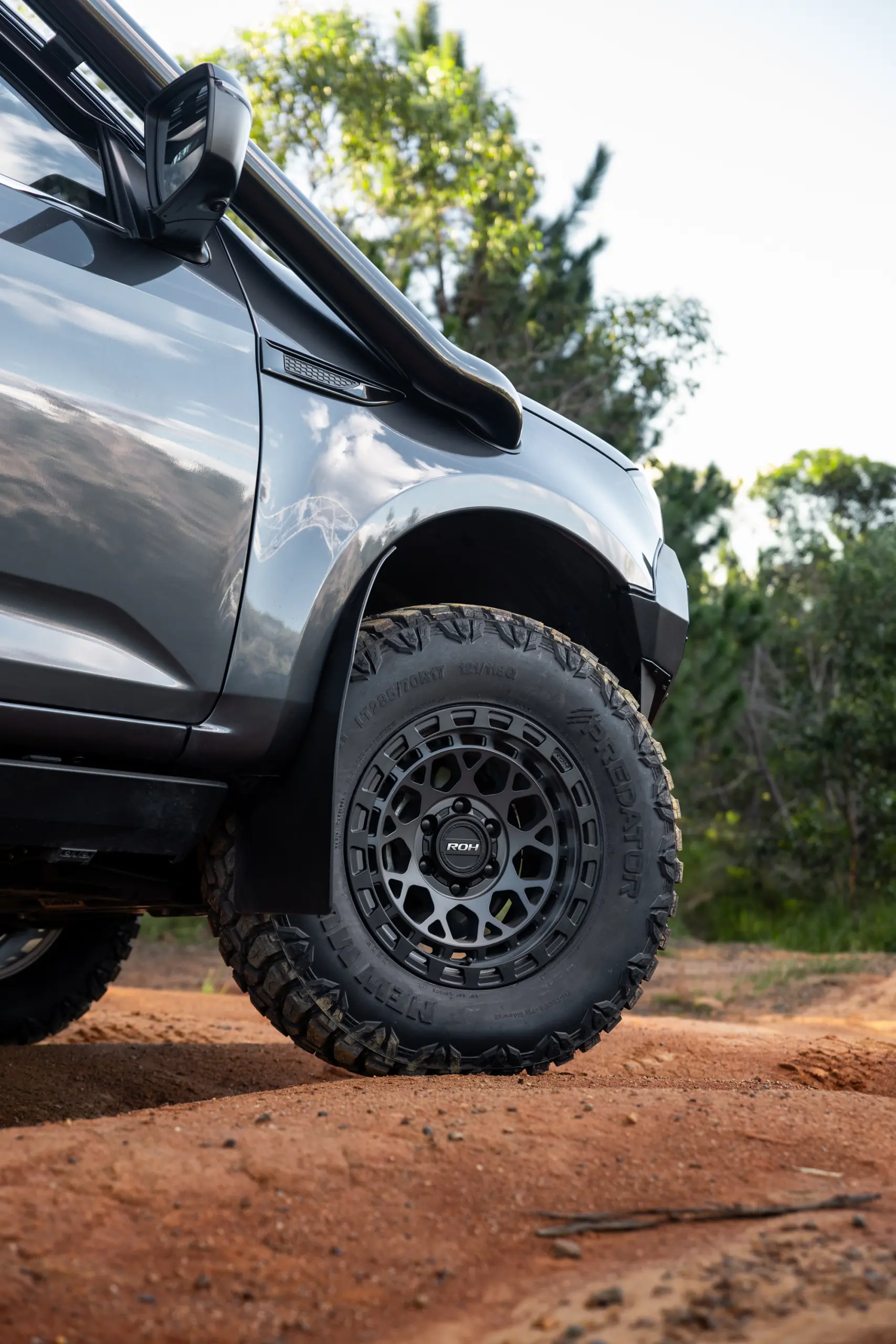 Grey Isuzu MU-X with ROH Atlas 4x4 Wheel in Graphite Centre Black Lip finish off road