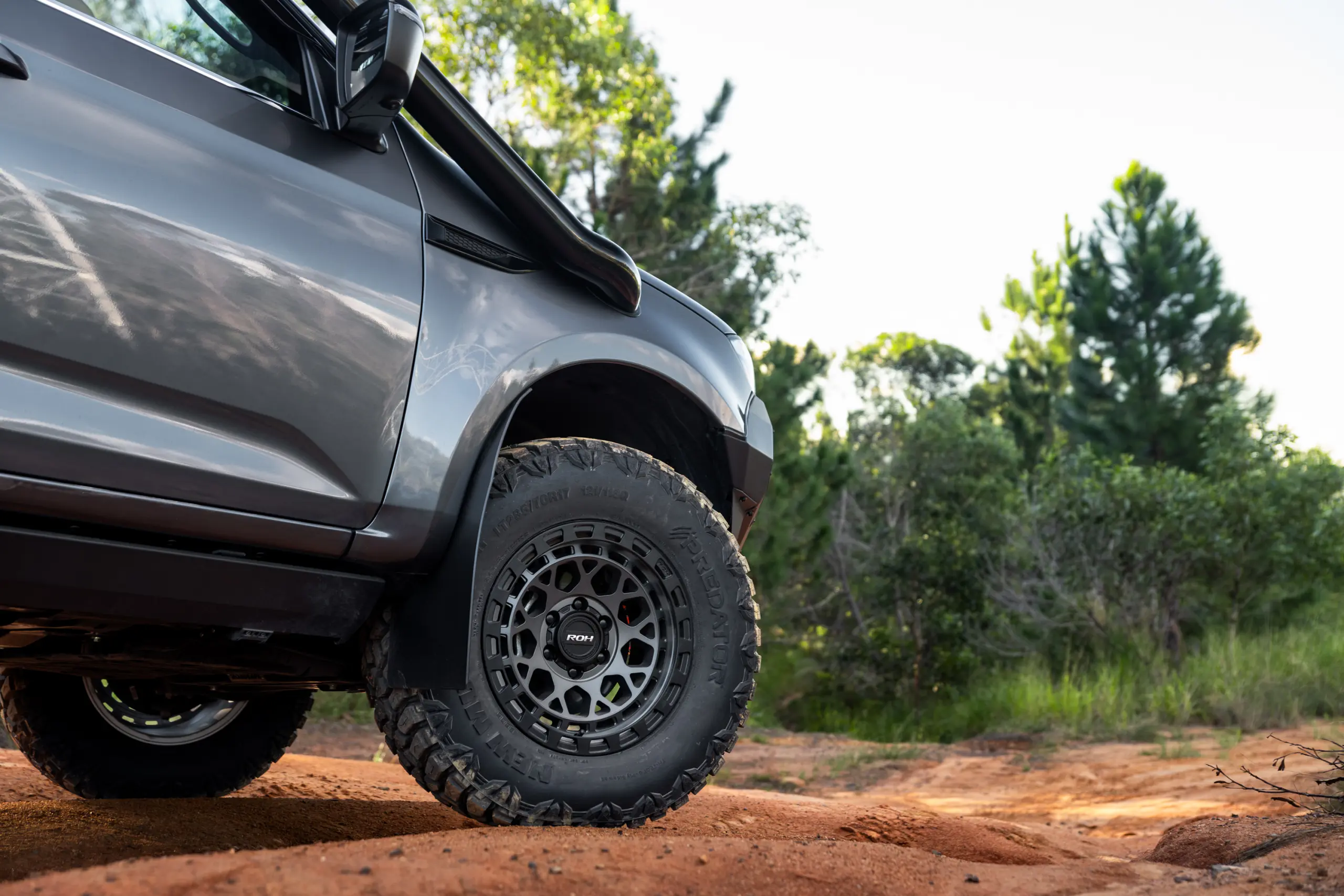 Grey Isuzu MU-X with ROH Atlas 4x4 Wheel in Graphite Centre Black Lip finish off road