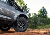Grey Isuzu MU-X with ROH Atlas 4x4 Wheel in Graphite Centre Black Lip finish off road