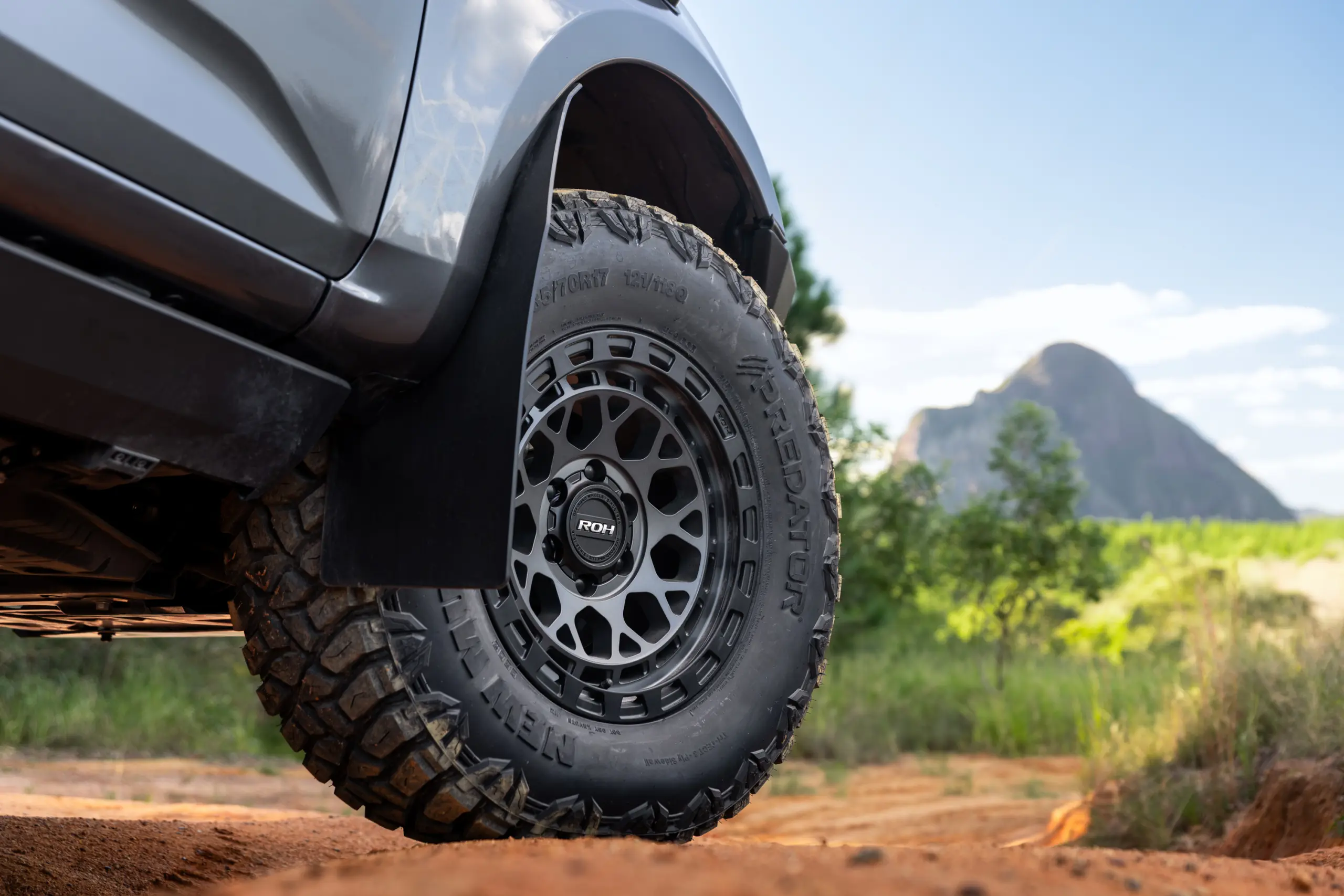 Grey Isuzu MU-X with ROH Atlas 4x4 Wheel in Graphite Centre Black Lip finish off road
