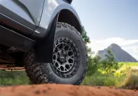 Grey Isuzu MU-X with ROH Atlas 4x4 Wheel in Graphite Centre Black Lip finish off road