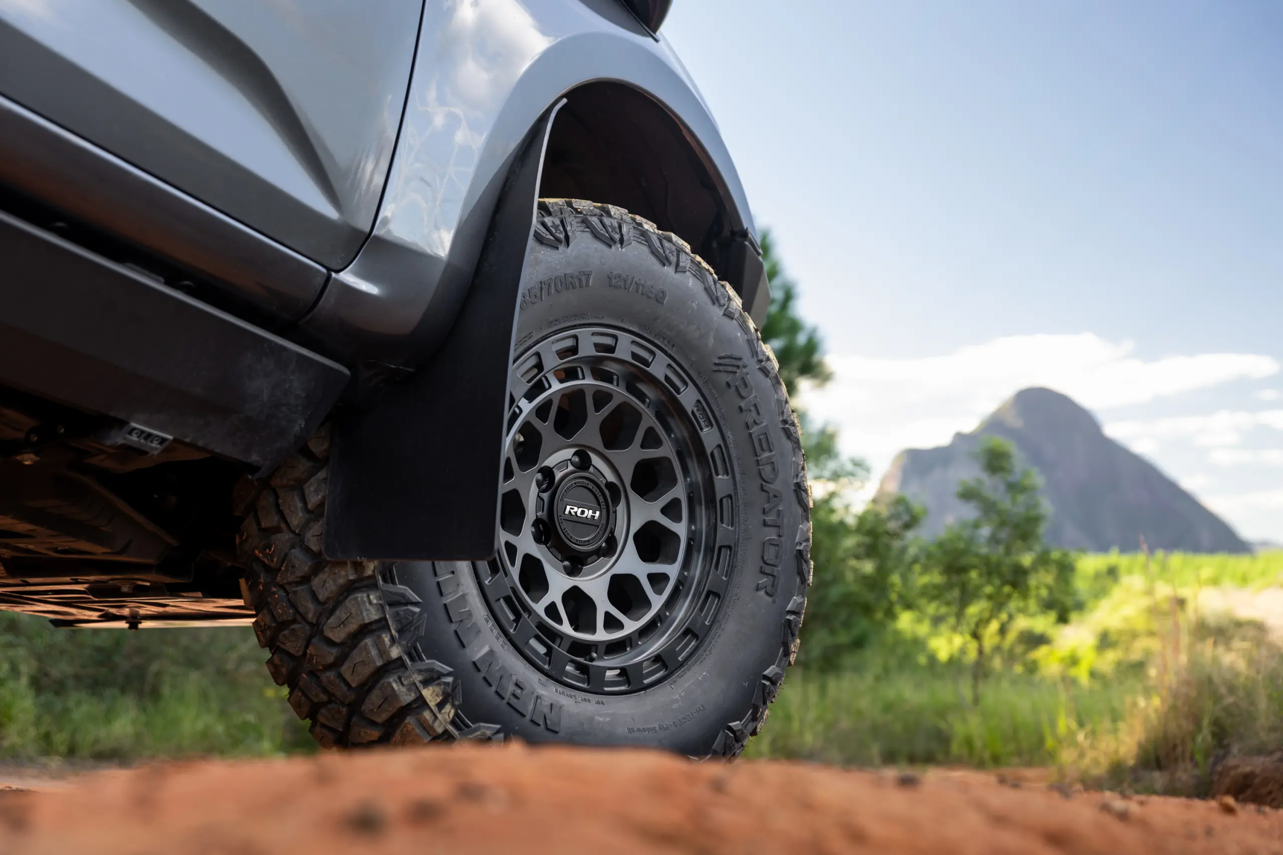 Grey Isuzu MU-X with ROH Atlas 4x4 Wheel in Graphite Centre Black Lip finish off road