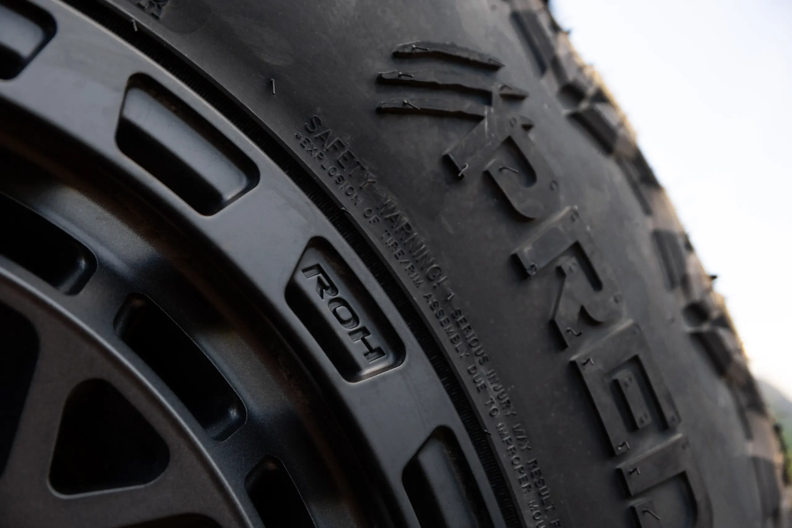 Close-up of ROH Logo on Atlas 4x4 Wheel in Graphite Centre Black Lip finish
