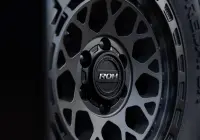 Close-up of ROH Cap on Atlas 4x4 Wheel in Graphite Centre Black Lip finish