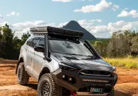 Grey Isuzu MU-X with ROH Atlas 4x4 Wheel in Graphite Centre Black Lip finish off road