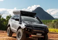 Grey Isuzu MU-X with ROH Atlas 4x4 Wheel in Graphite Centre Black Lip finish off road