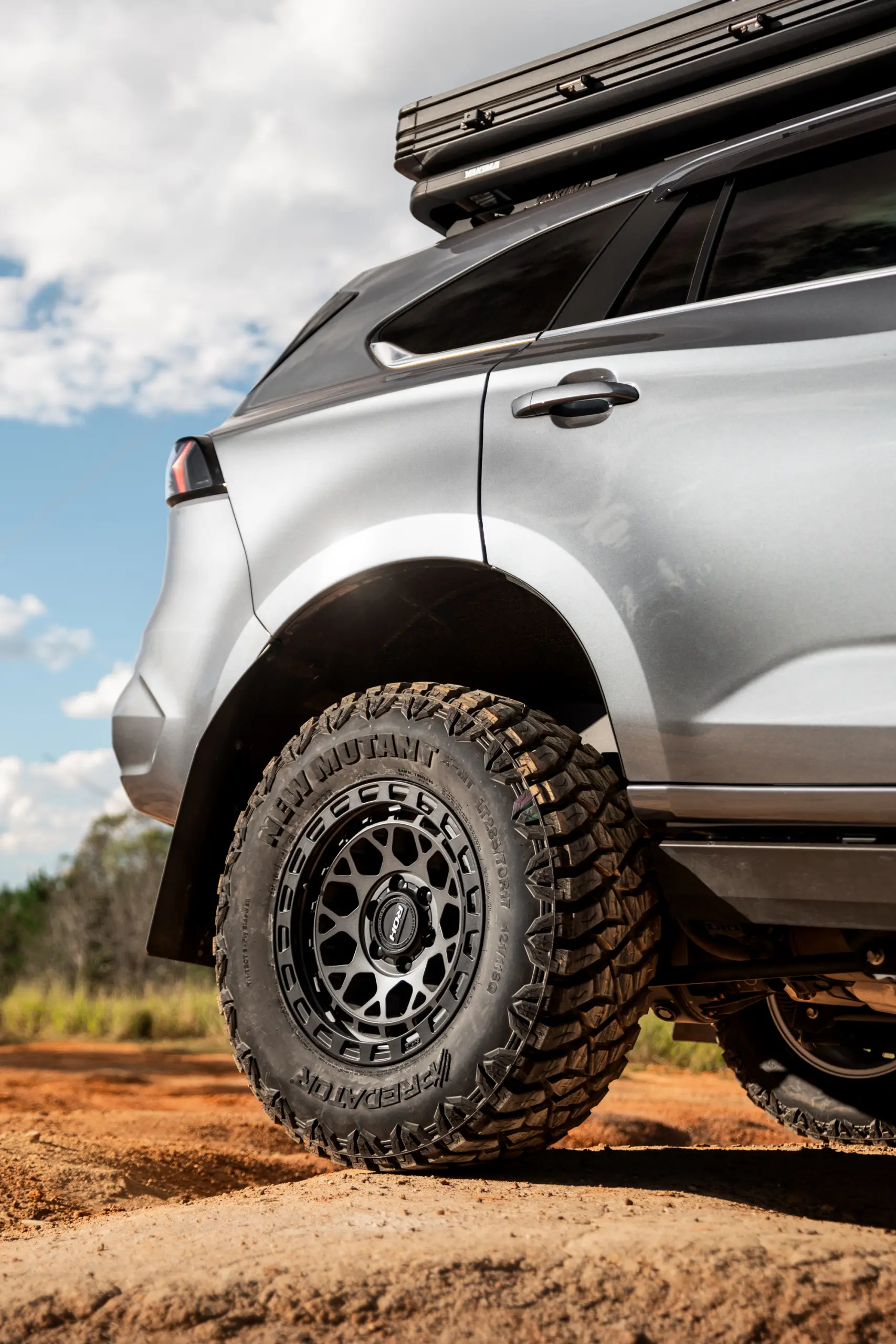 Grey Isuzu MU-X with ROH Atlas 4x4 Wheel in Graphite Centre Black Lip finish off road