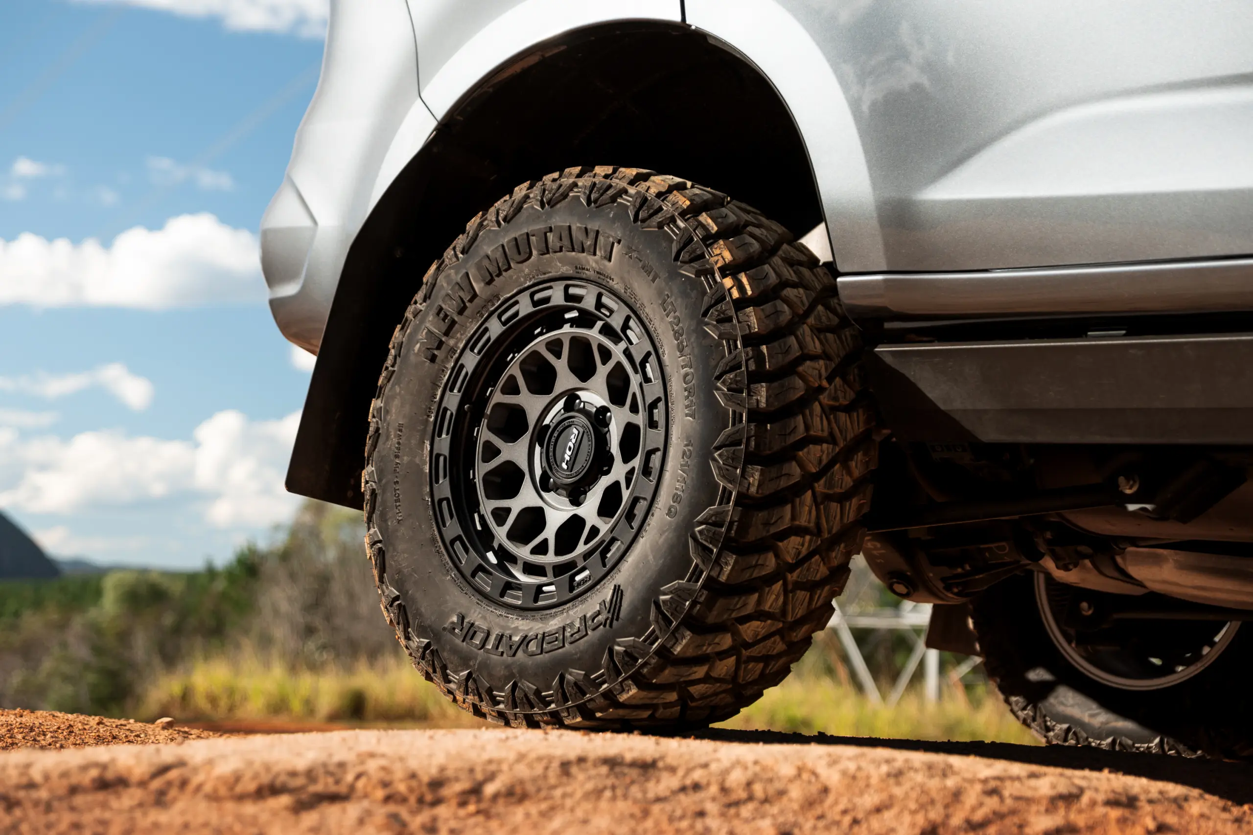 Grey Isuzu MU-X with ROH Atlas 4x4 Wheel in Graphite Centre Black Lip finish off road