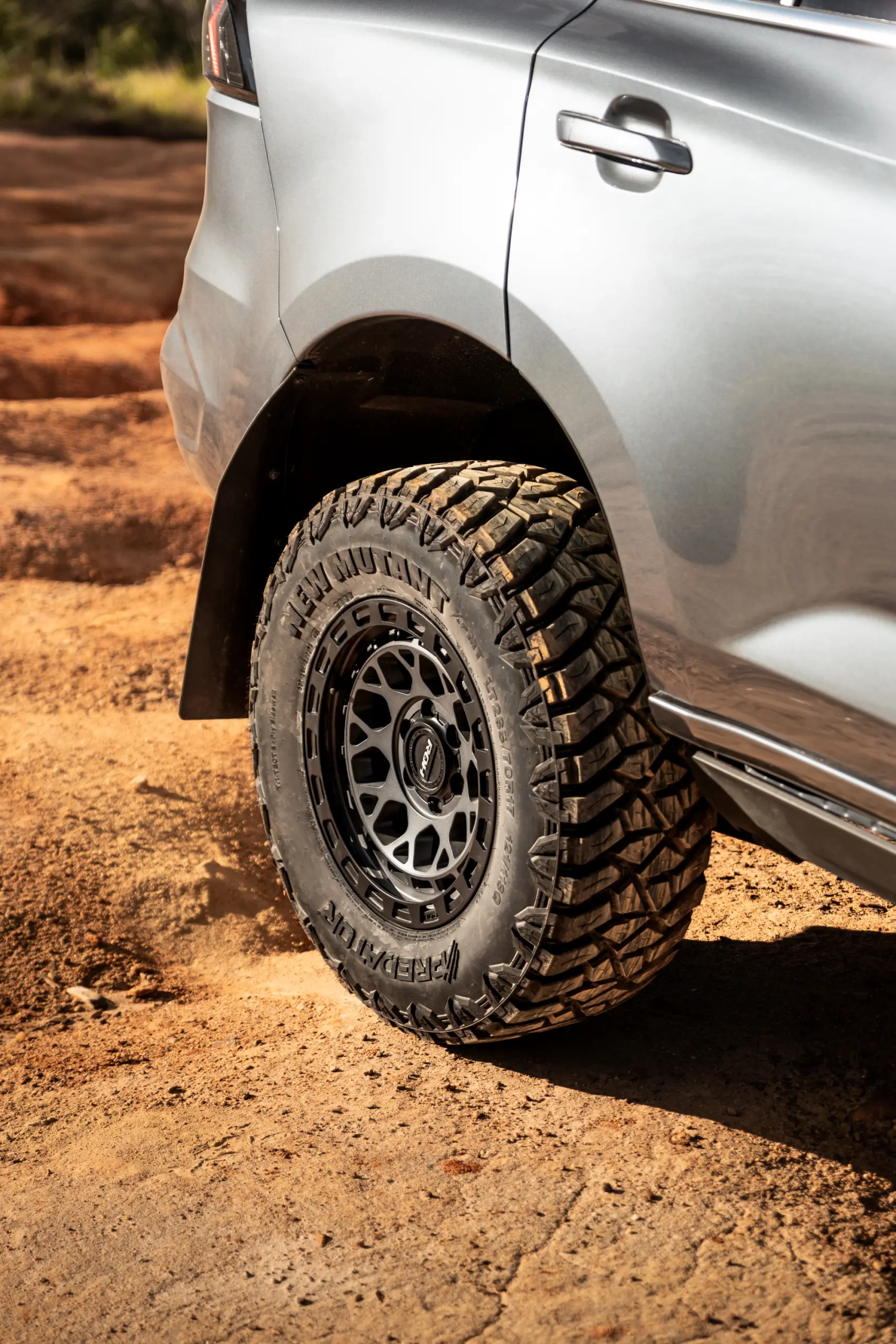 Grey Isuzu MU-X with ROH Atlas 4x4 Wheel in Graphite Centre Black Lip finish off road