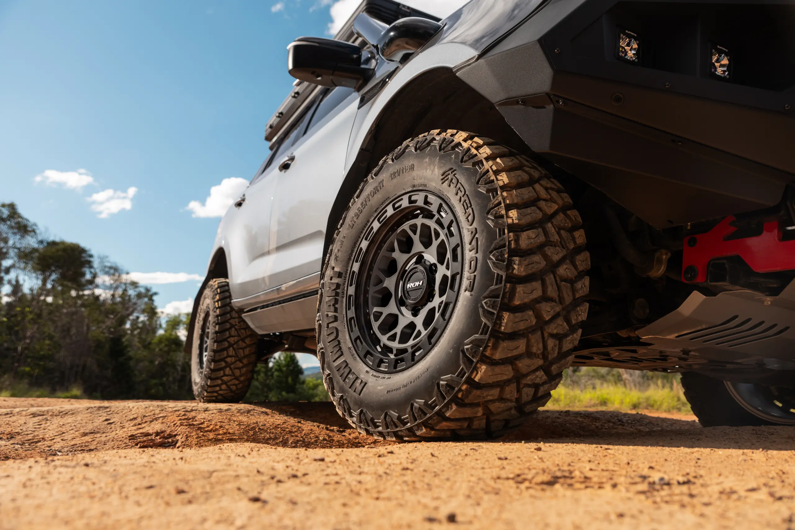 Grey Isuzu MU-X with ROH Atlas 4x4 Wheel in Graphite Centre Black Lip finish off road