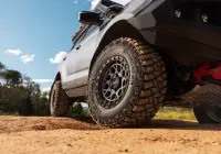 Grey Isuzu MU-X with ROH Atlas 4x4 Wheel in Graphite Centre Black Lip finish off road