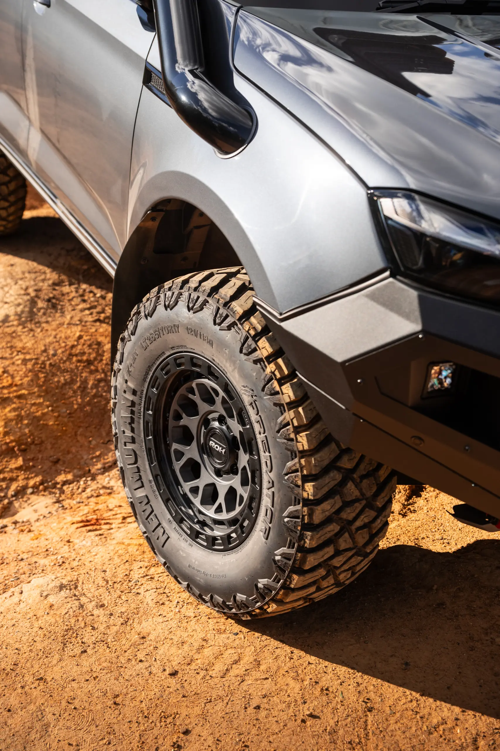 Grey Isuzu MU-X with ROH Atlas 4x4 Wheel in Graphite Centre Black Lip finish off road