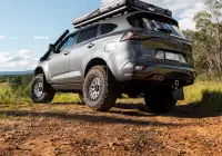 Grey Isuzu MU-X with ROH Atlas 4x4 Wheel in Machined Centre Black Lip finish off road