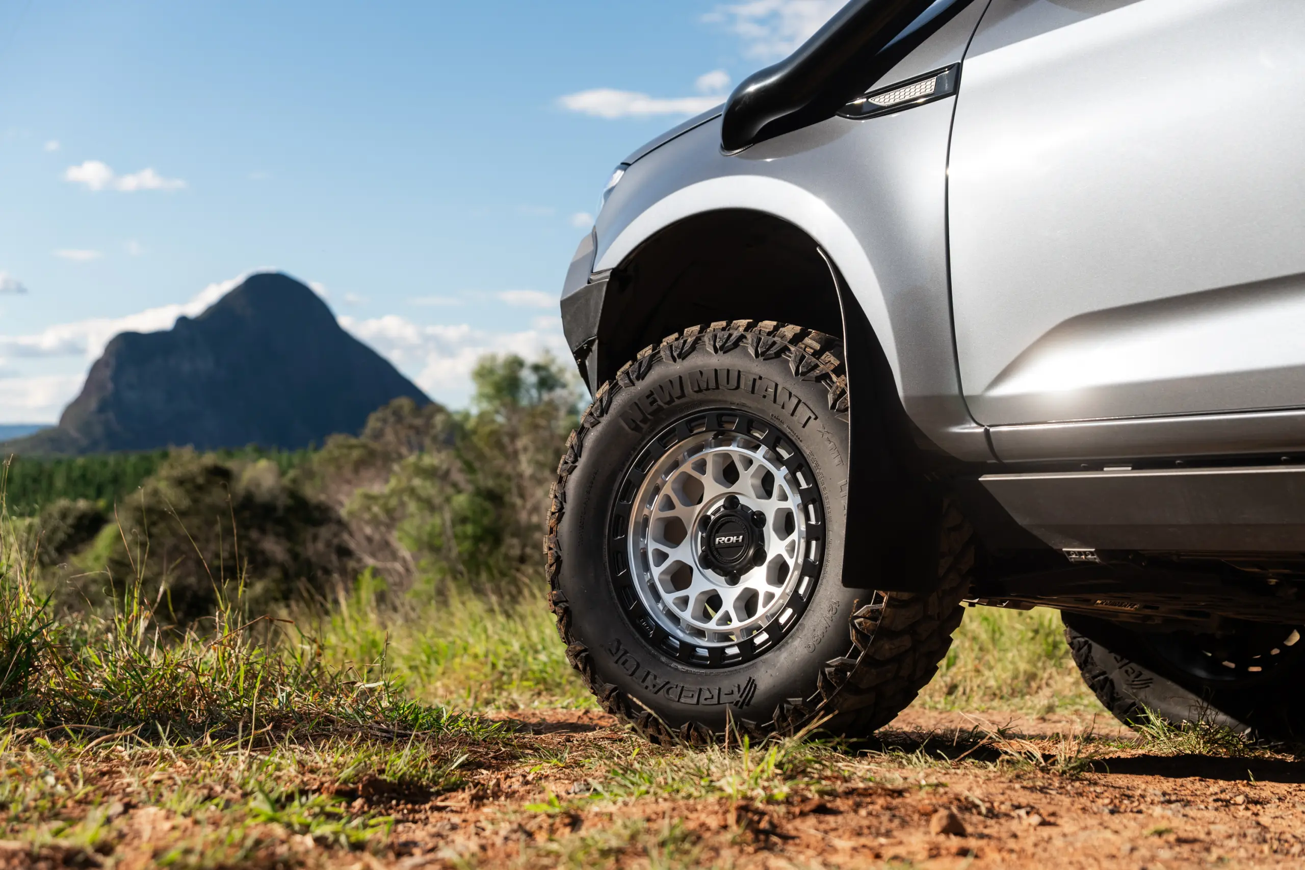 Grey Isuzu MU-X with ROH Atlas 4x4 Wheel in Machined Centre Black Lip finish off road