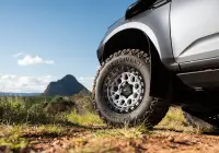 Grey Isuzu MU-X with ROH Atlas 4x4 Wheel in Machined Centre Black Lip finish off road