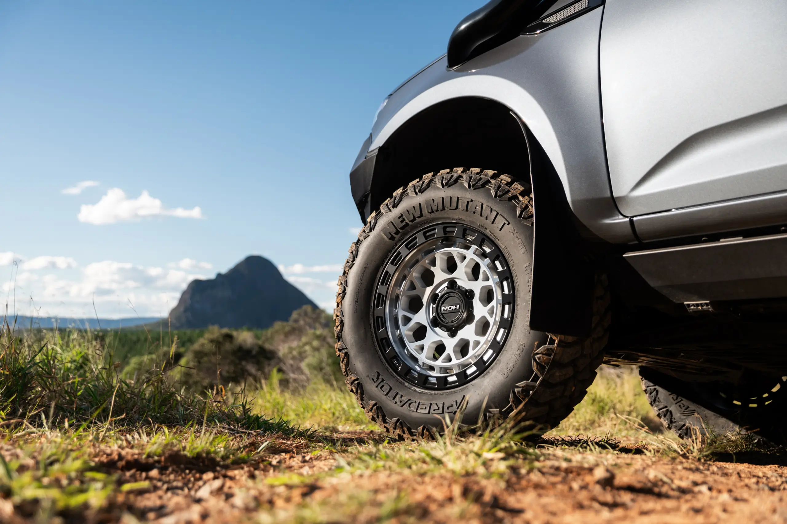 Grey Isuzu MU-X with ROH Atlas 4x4 Wheel in Machined Centre Black Lip finish off road