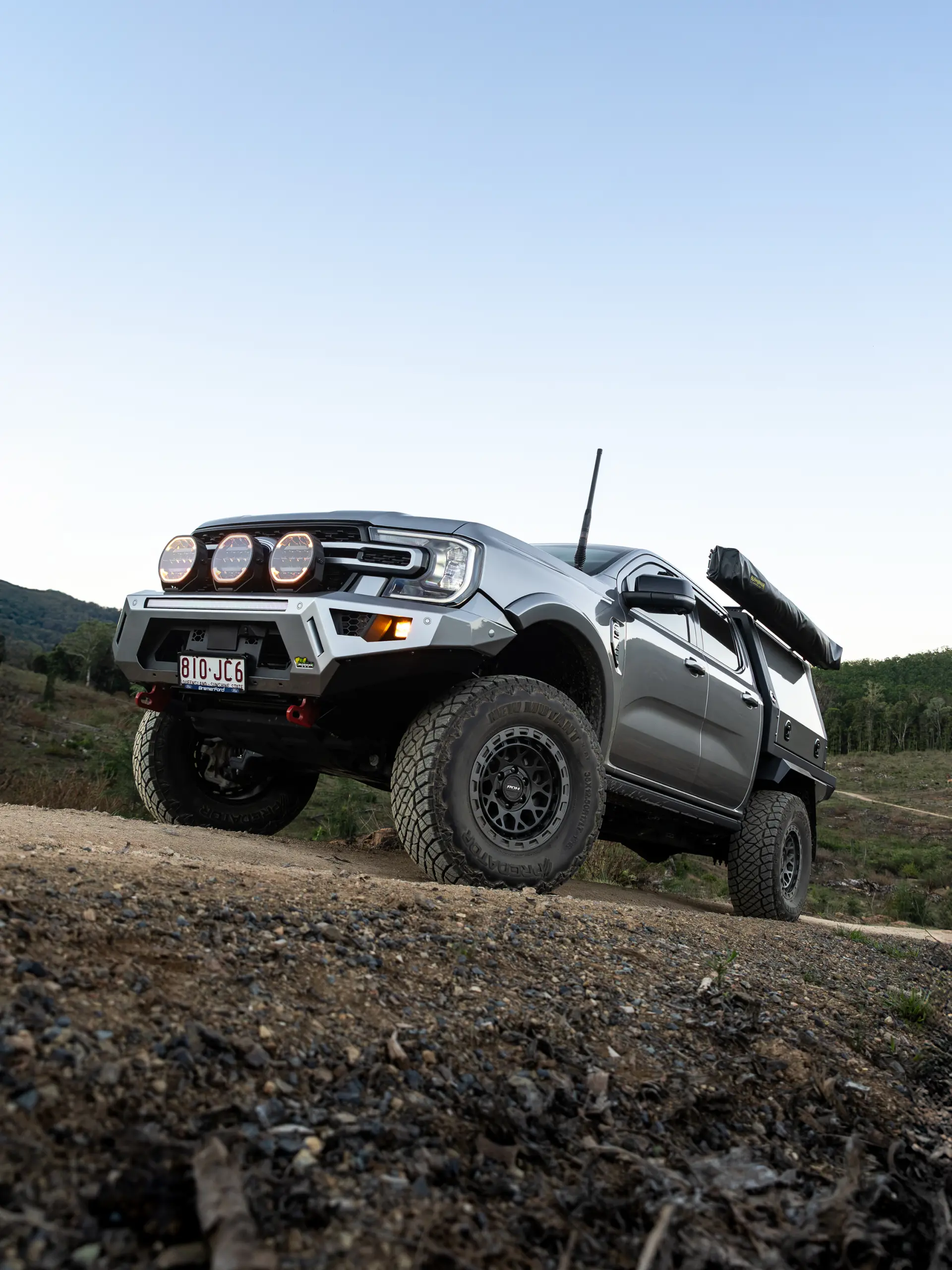 Silver Ford Ranger Next-Gen with 17x9 +12 ROH Atlas 4x4 Wheel in Black Centre Graphite Lip finish in forest