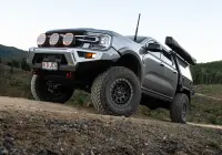 Silver Ford Ranger Next-Gen with 17x9 +12 ROH Atlas 4x4 Wheel in Black Centre Graphite Lip finish in forest