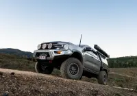 Silver Ford Ranger Next-Gen with 17x9 +12 ROH Atlas 4x4 Wheel in Black Centre Graphite Lip finish in forest
