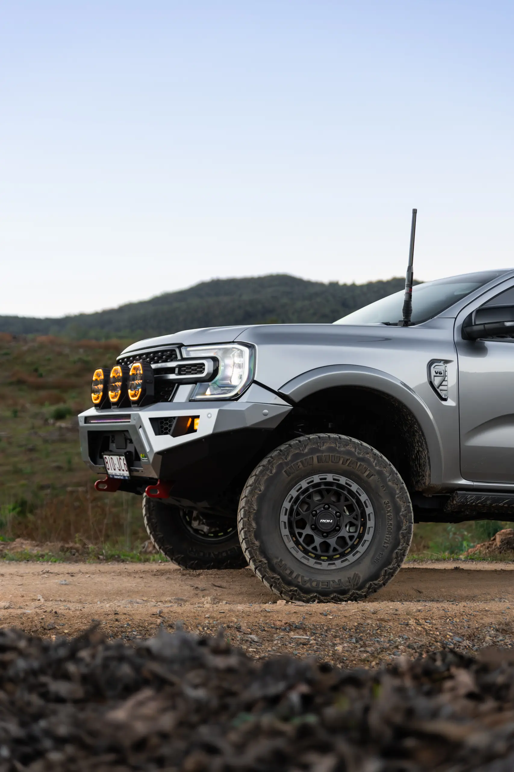 Silver Ford Ranger Next-Gen with 17x9 +12 ROH Atlas 4x4 Wheel in Black Centre Graphite Lip finish in forest