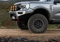 Silver Ford Ranger Next-Gen with 17x9 +12 ROH Atlas 4x4 Wheel in Black Centre Graphite Lip finish in forest