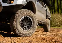Silver Ford Ranger Next-Gen with 17x9 +12 ROH Atlas 4x4 Wheel in Black Centre Graphite Lip finish in forest
