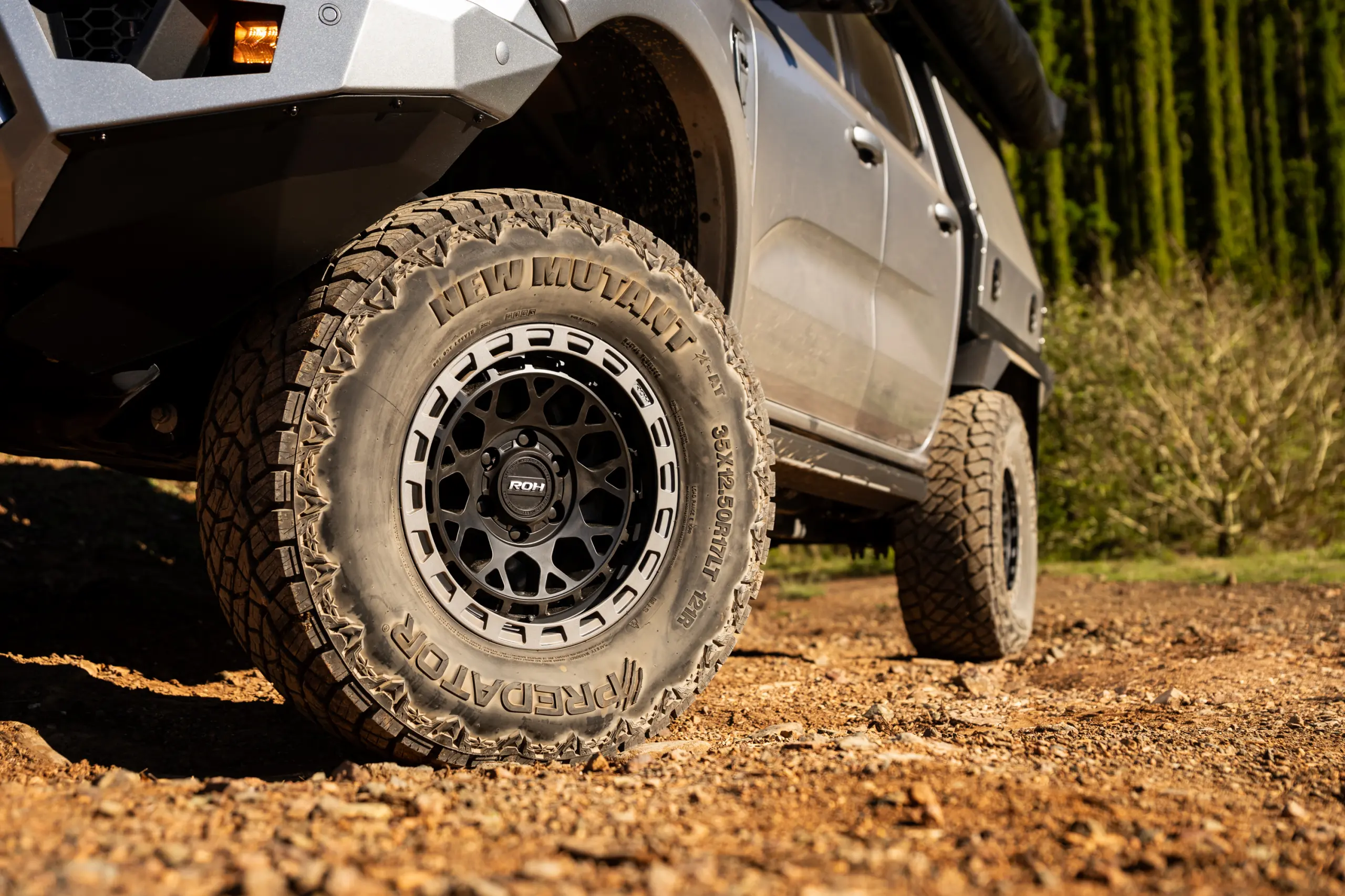 Silver Ford Ranger Next-Gen with 17x9 +12 ROH Atlas 4x4 Wheel in Black Centre Graphite Lip finish in forest