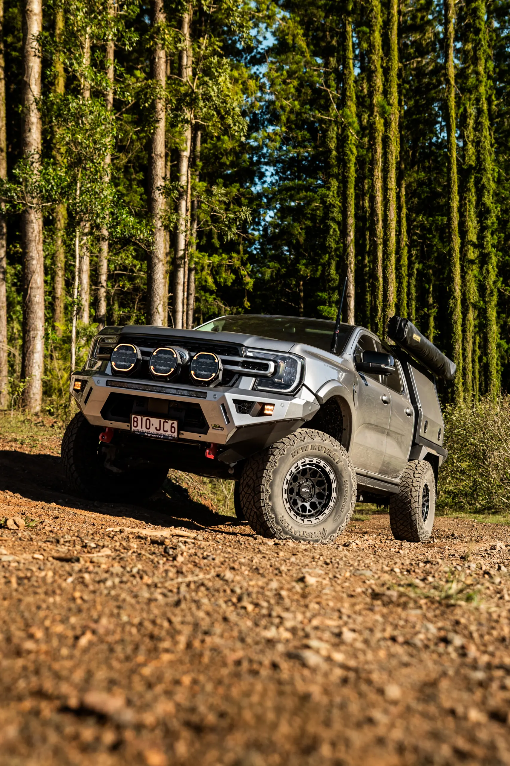 Silver Ford Ranger Next-Gen with 17x9 +12 ROH Atlas 4x4 Wheel in Black Centre Graphite Lip finish in forest