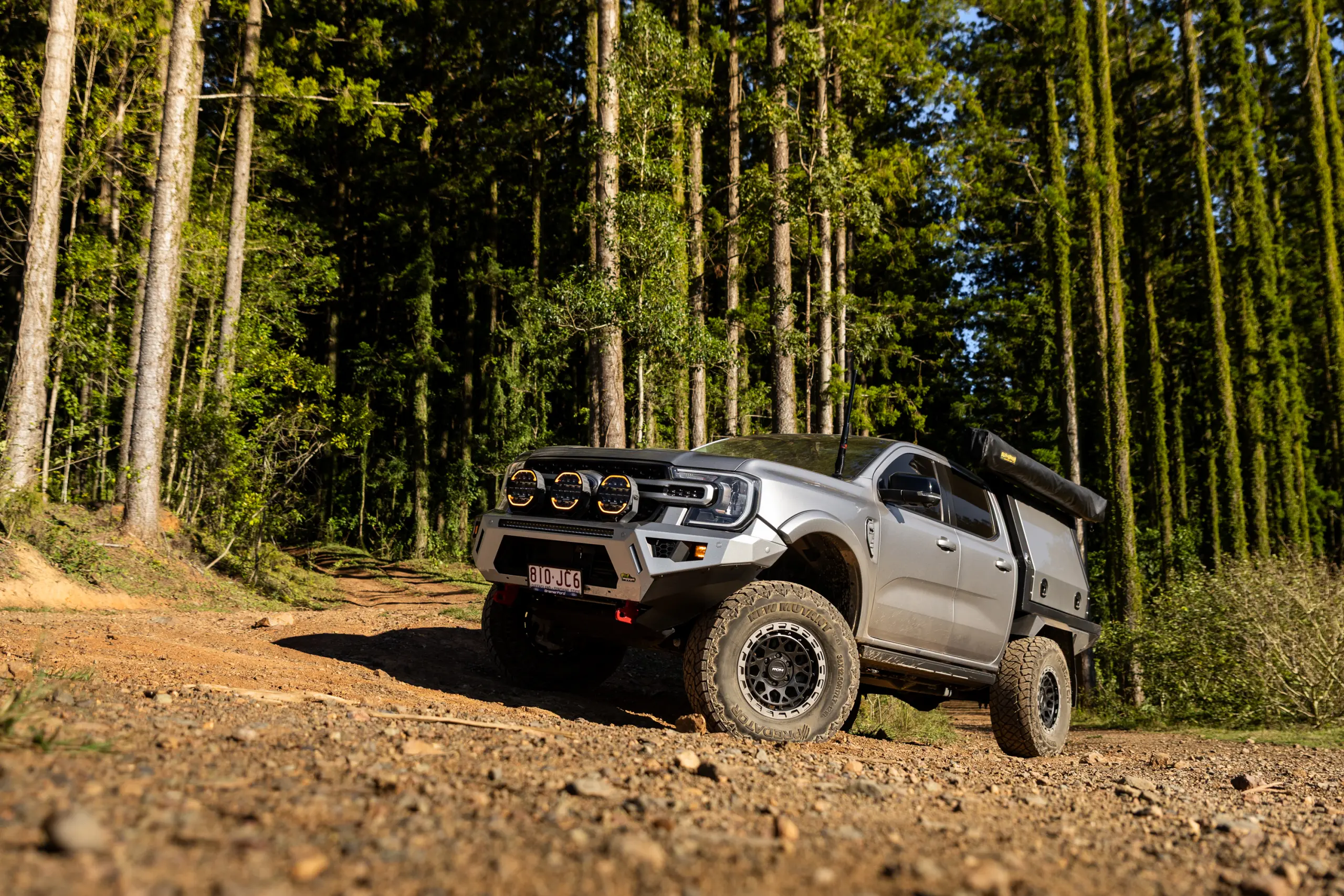 Silver Ford Ranger Next-Gen with 17x9 +12 ROH Atlas 4x4 Wheel in Black Centre Graphite Lip finish in forest