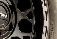 Close-up of spokes on 17x9 +12 ROH Atlas 4x4 Wheel in Black Centre Graphite Lip finish