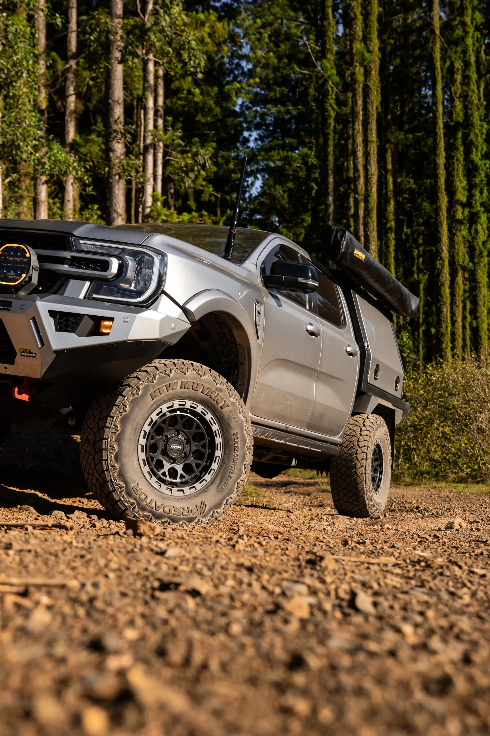Silver Ford Ranger Next-Gen with 17x9 +12 ROH Atlas 4x4 Wheel in Black Centre Graphite Lip finish in forest