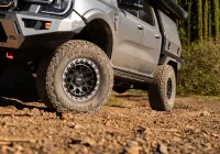 Silver Ford Ranger Next-Gen with 17x9 +12 ROH Atlas 4x4 Wheel in Black Centre Graphite Lip finish in forest