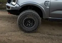 Silver Ford Ranger Next-Gen with 17x9 +12 ROH Atlas 4x4 Wheel in Black Centre Graphite Lip finish in forest