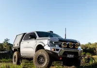 Silver Ford Ranger Next-Gen with 17x9 +12 ROH Atlas 4x4 Wheel in Matte Black in forest