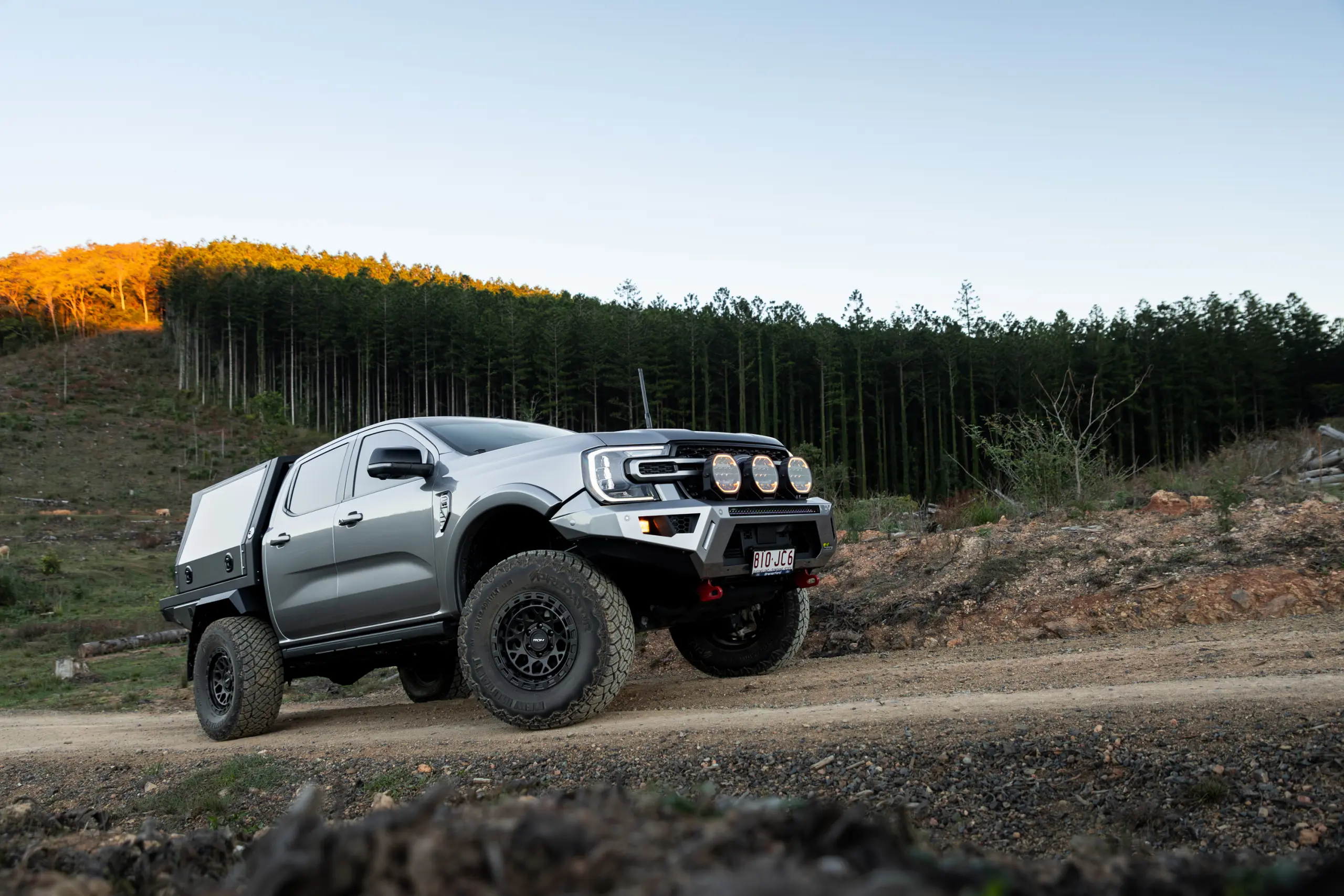 Silver Ford Ranger Next-Gen with 17x9 +12 ROH Atlas 4x4 Wheel in Matte Black in forest