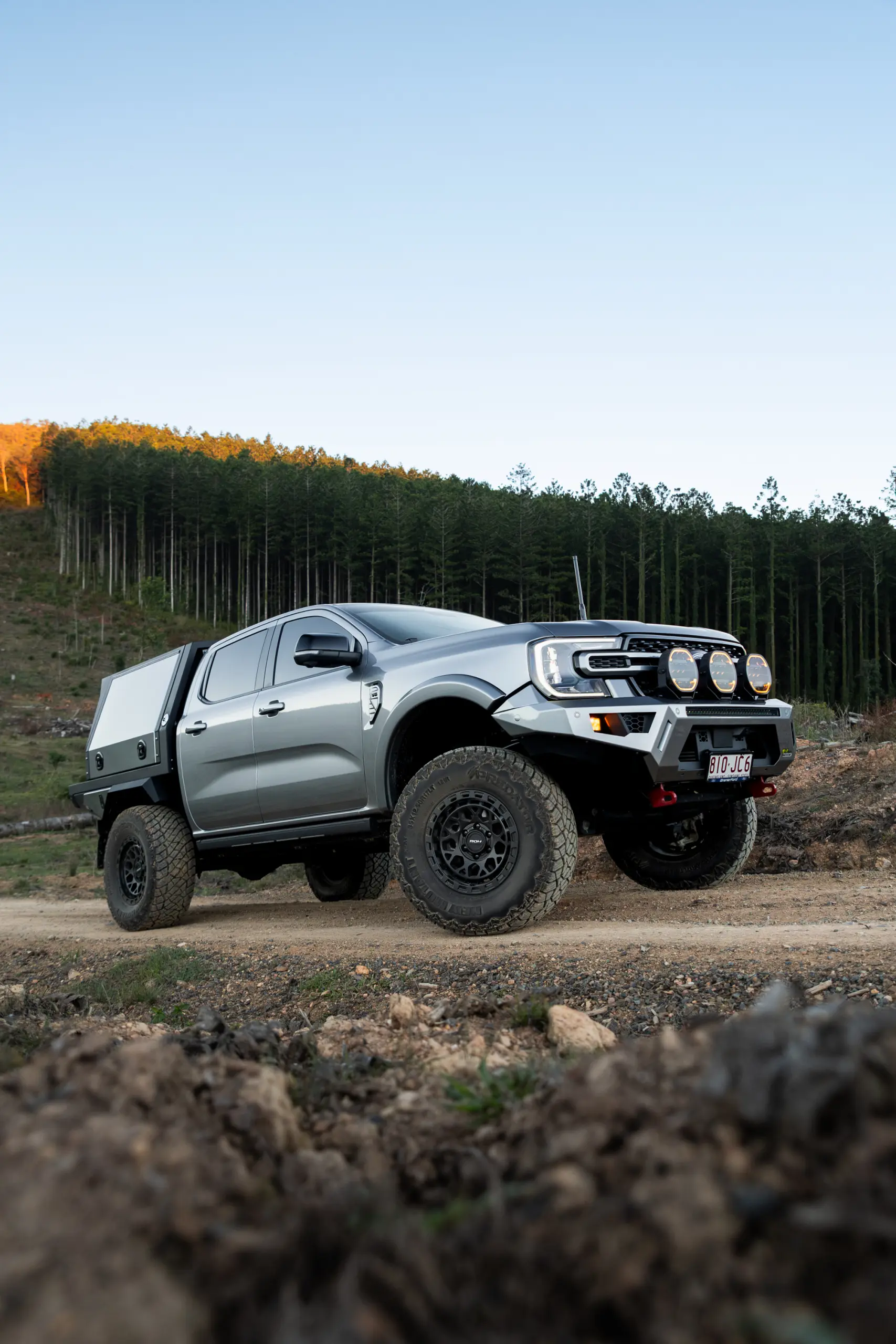 Silver Ford Ranger Next-Gen with 17x9 +12 ROH Atlas 4x4 Wheel in Matte Black in forest
