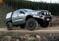 Silver Ford Ranger Next-Gen with 17x9 +12 ROH Atlas 4x4 Wheel in Matte Black in forest
