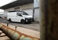 Toyota HiAce H300 Van with ROH Torque Matte Black Wheels in industrial area