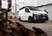 Toyota HiAce H300 Van with ROH Torque Matte Black Wheels in industrial area