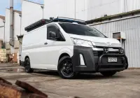 Toyota HiAce H300 Van with ROH Torque Matte Black Wheels in industrial area