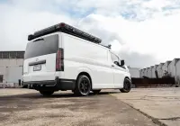 Toyota HiAce H300 Van with ROH Torque Matte Black Wheels in industrial area