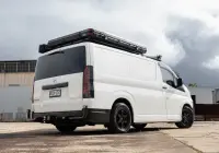 Toyota HiAce H300 Van with ROH Torque Matte Black Wheels in industrial area